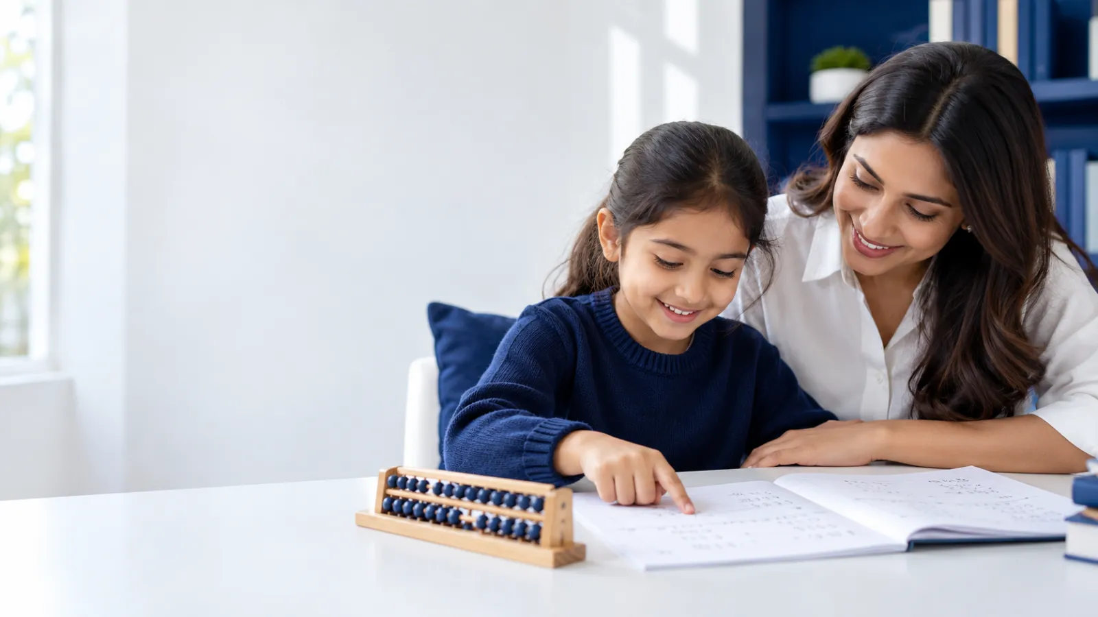 Parent and daughter reading an abacus and mental maths worksheet together at a white desk, with a small abacus beside them